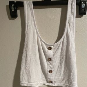 White top with brown buttons